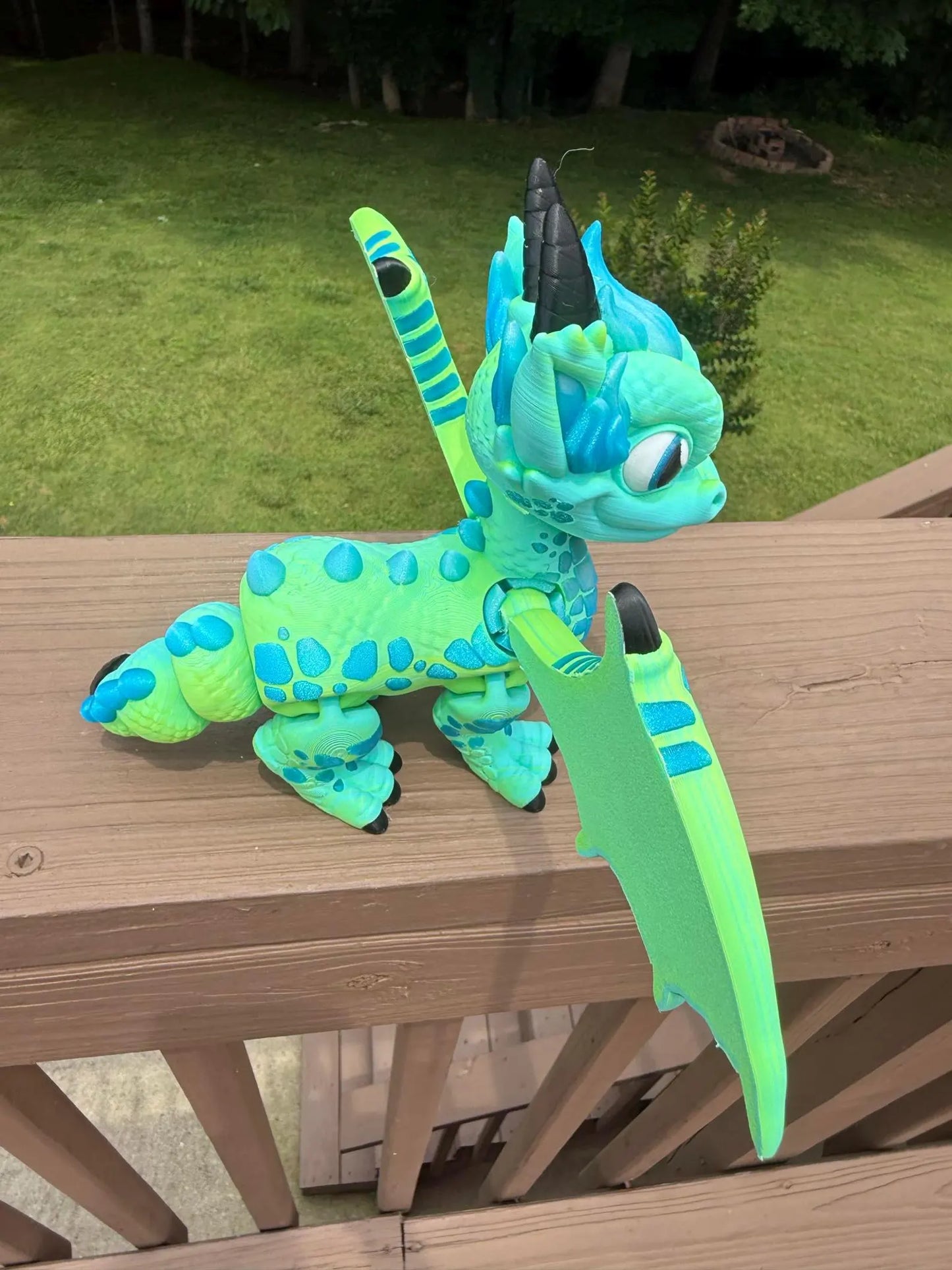 Large blue and green 3D printed articulated western dragon