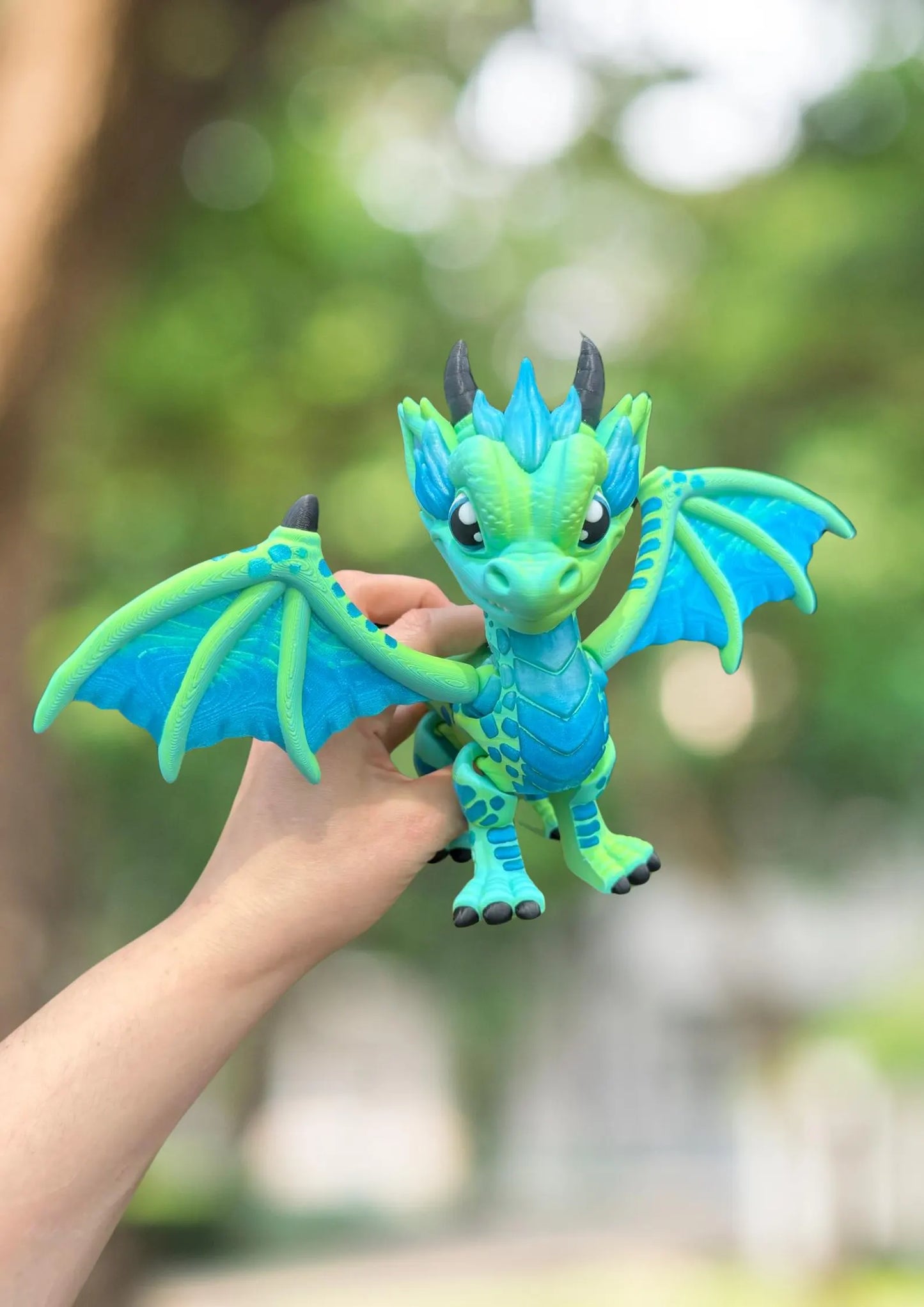 Large blue and green 3D printed articulated western dragon
