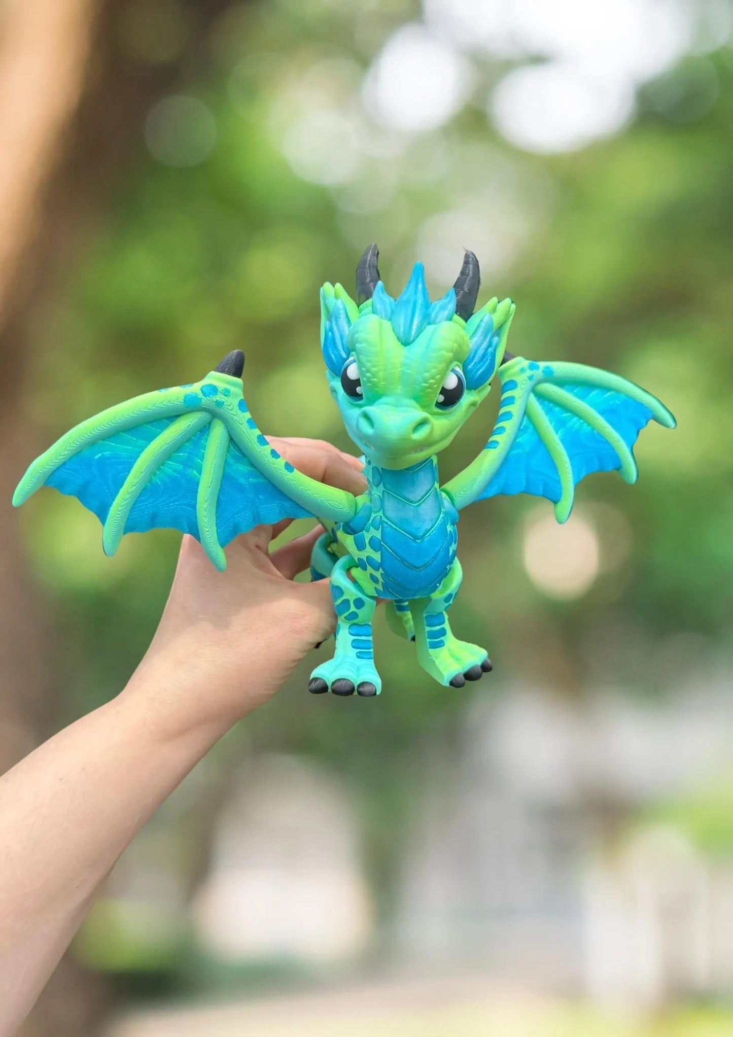 Large blue and green 3D printed articulated western dragon