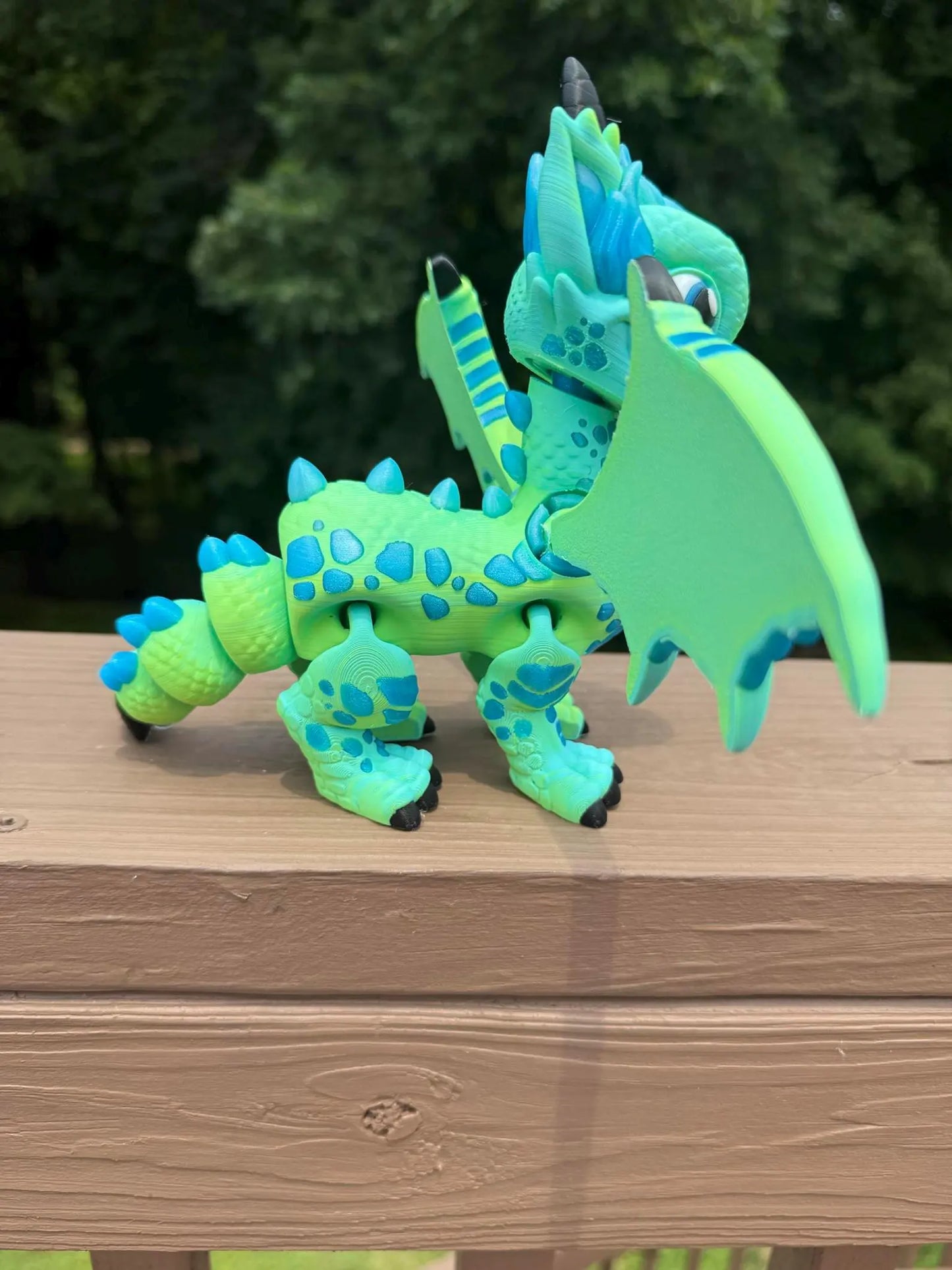 Large blue and green 3D printed articulated western dragon