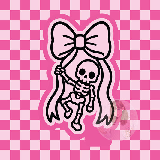 Skeleton hanging from bow silicone freshie mold